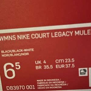Selling woman’s black and white Nike court legacy mule shoes size 6.5 US